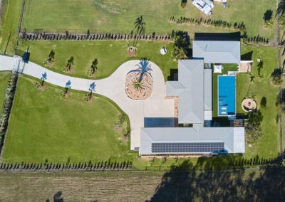 aerial shot of a house with pool