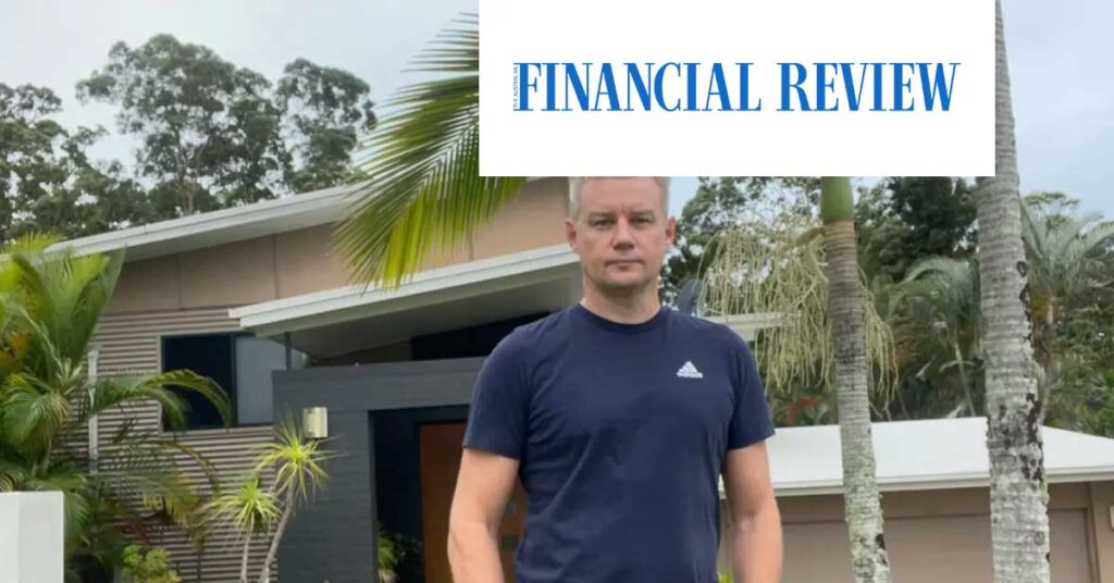 owner of the house standing in front of his home